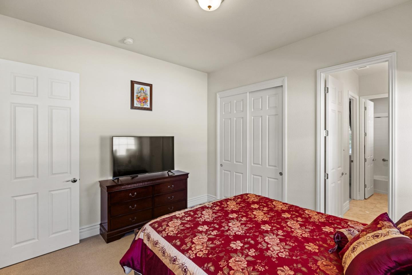 18511 McClellan Circle East Garrison, CA 93933 - Photo 36 of 65 a bedroom with a bed and a flat screen tv