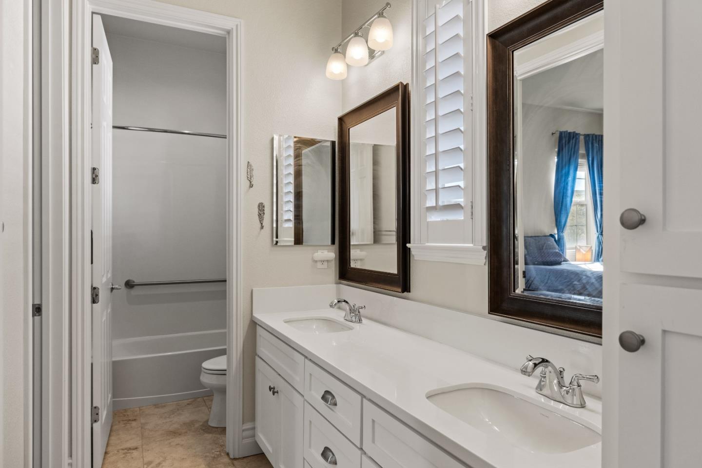 18511 McClellan Circle East Garrison, CA 93933 - Photo 38 of 65 a bathroom with a granite countertop sink mirror and double
