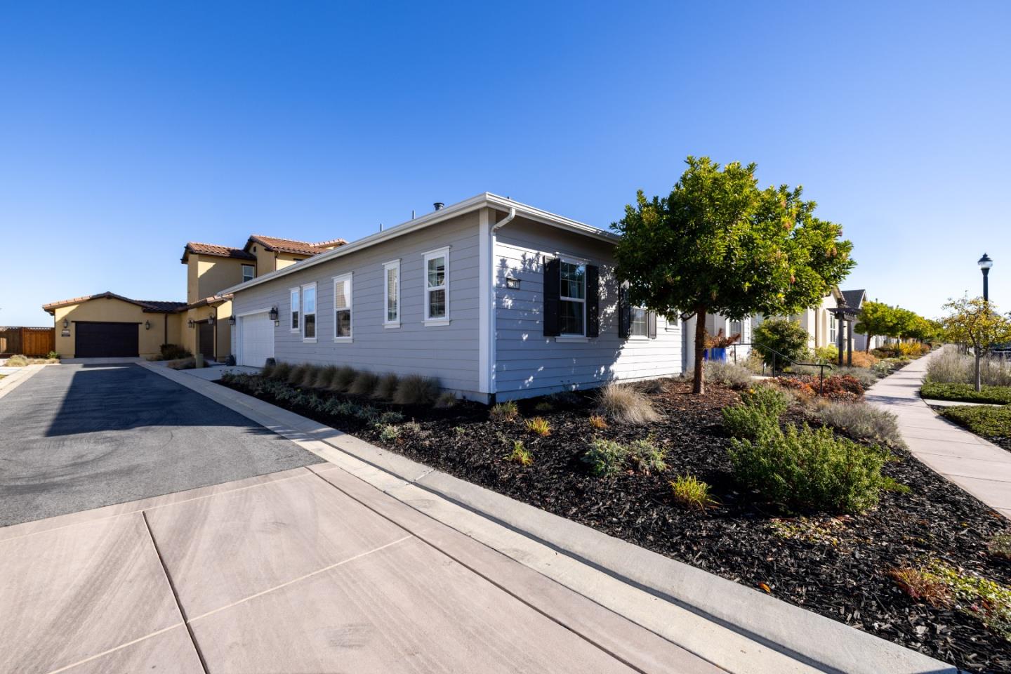 18511 McClellan Circle East Garrison, CA 93933 - Photo 62 of 65 a front view of a house with a yard