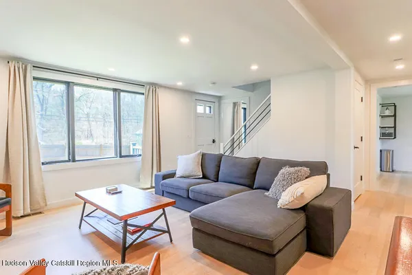 a living room with furniture and a large window