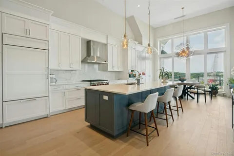a view of a chairs and table in front of house