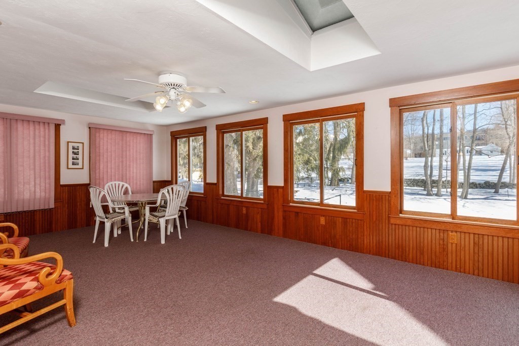 196 Chestnut Street Gardner, MA 01440 - Photo 12 of 30 a living room with furniture a chandelier fan and a large window
