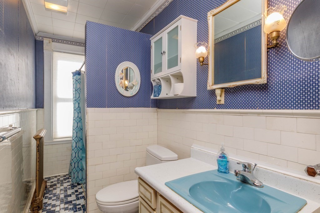 196 Chestnut Street Gardner, MA 01440 - Photo 19 of 30 a bathroom with a toilet a sink and mirror