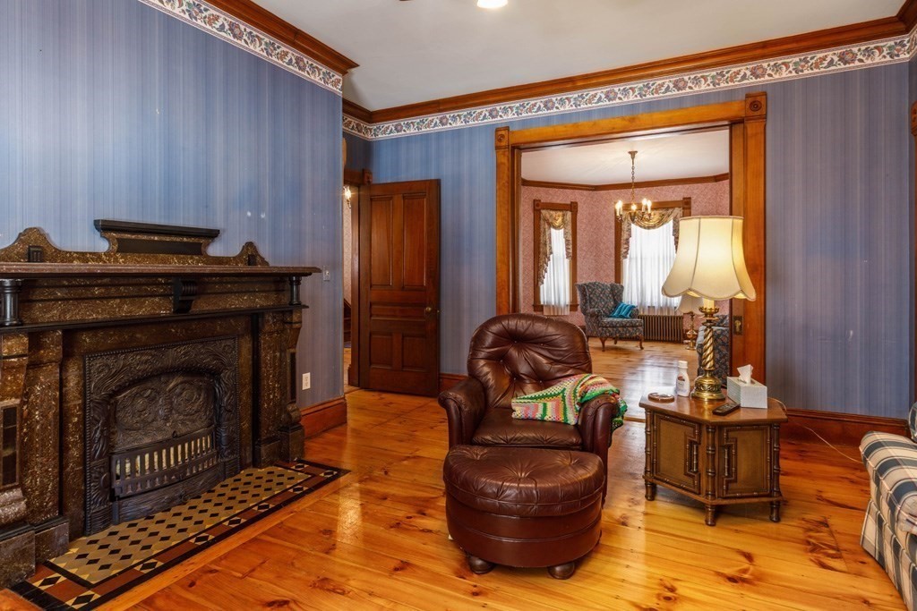 196 Chestnut Street Gardner, MA 01440 - Photo 5 of 30 a living room with furniture and a fireplace