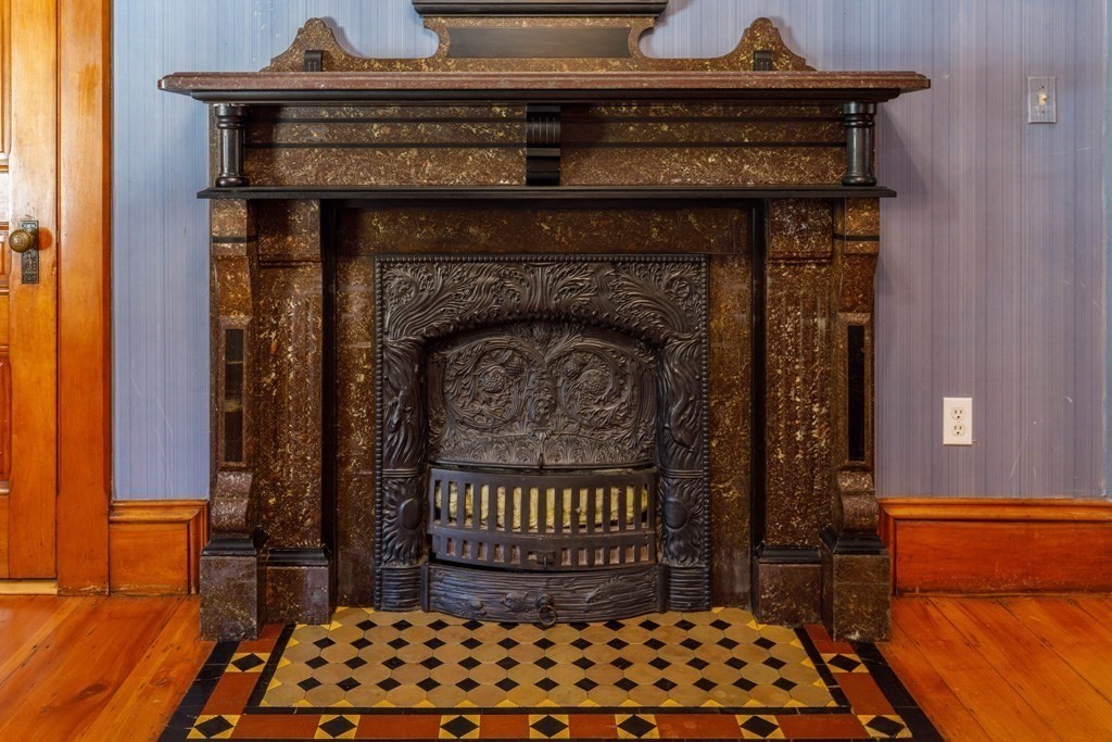 196 Chestnut Street Gardner, MA 01440 - Photo 6 of 30 a close view of a fireplace in a room