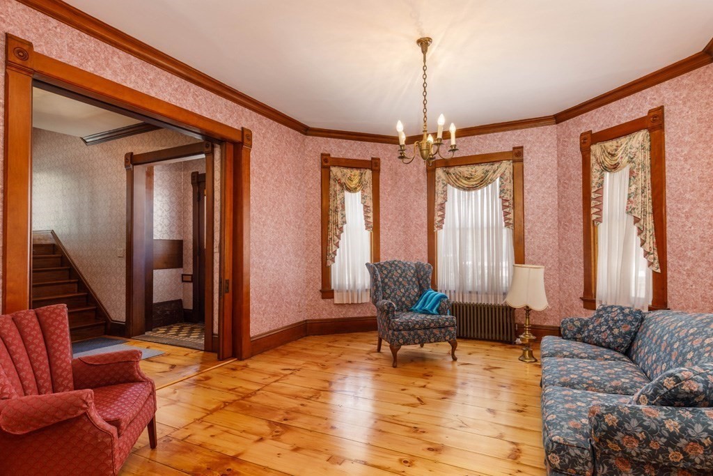 196 Chestnut Street Gardner, MA 01440 - Photo 7 of 30 a living room with furniture a window and a chandelier