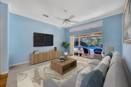 507 Surrey Lane Lutz, FL 33549 - Photo 17 of 27 a living room with furniture and a flat screen tv