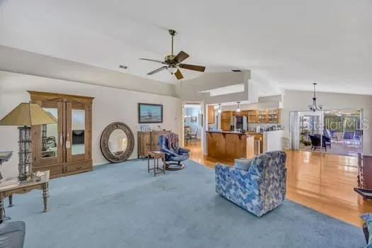 a view of a livingroom with furniture and a mirror