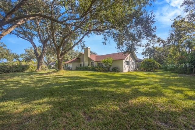 507 Surrey Lane Lutz, FL 33549 - Photo 2 of 27 a view of a house with a yard