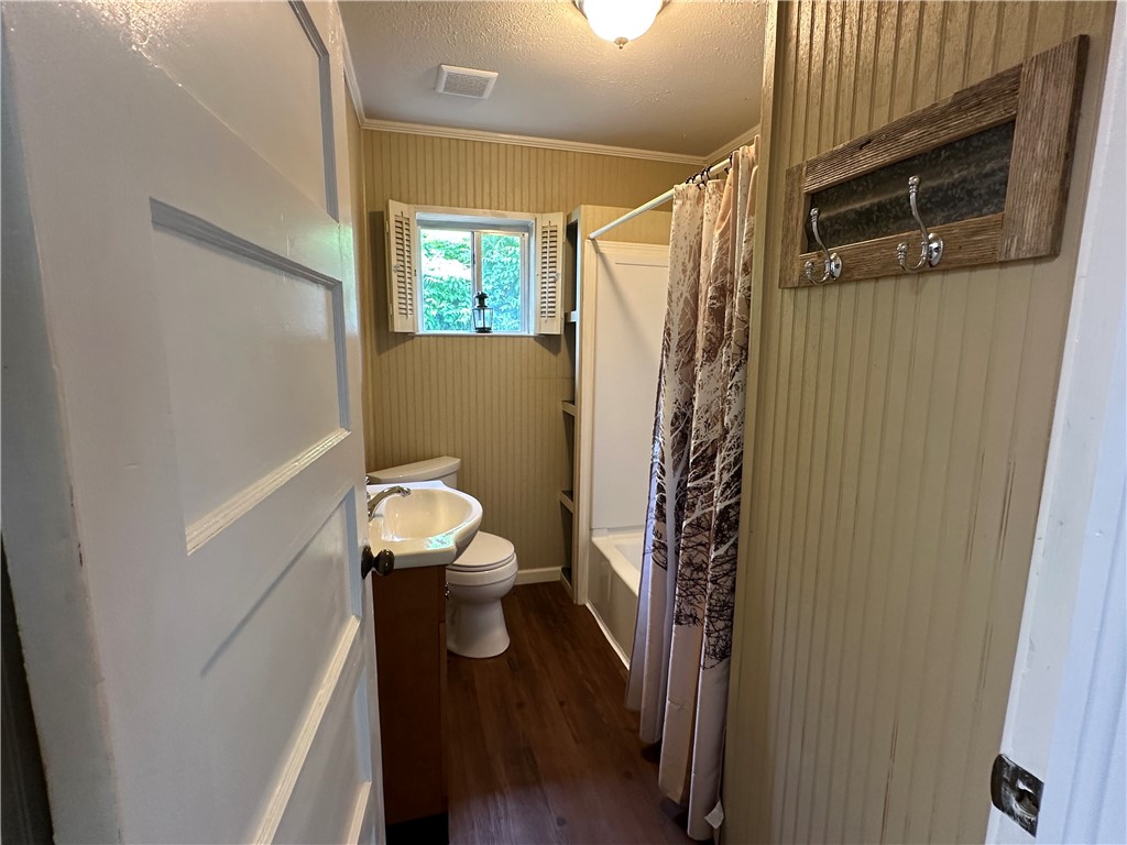 230 Lola Johnson Road Corpus Christi, TX 78418 - Photo 14 of 40 a bathroom with a toilet and a shower