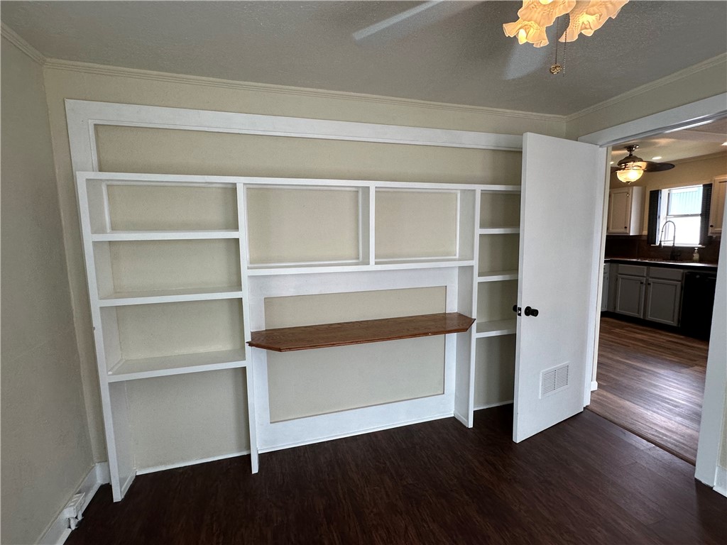 230 Lola Johnson Road Corpus Christi, TX 78418 - Photo 29 of 40 a view of a room with wooden floors and cabinet