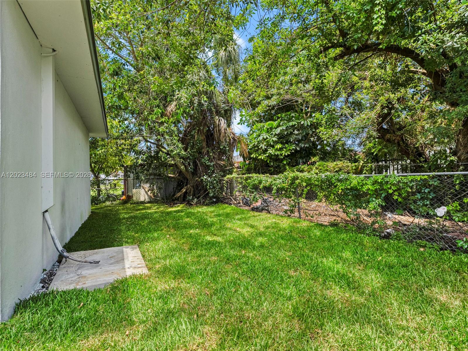 1961 Rutland Street Opa-Locka, FL 33054 - Photo 28 of 33 a view of a backyard with large trees