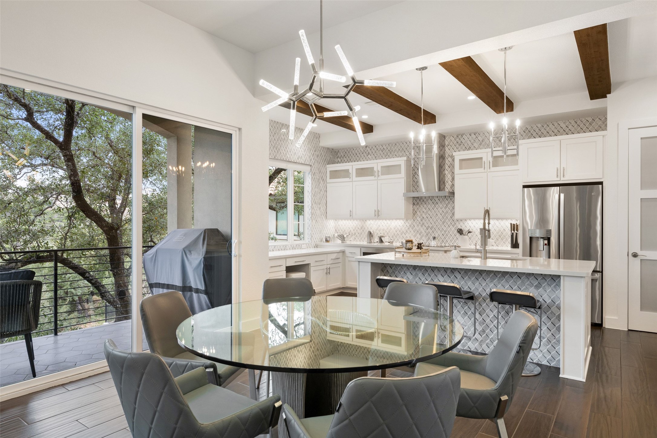 408 Rose Branch Way, Unit 24 Austin, TX 78738 - Photo 18 of 39 Dining space featuring dark wood-style flooring, beam ceiling, and a chandelier