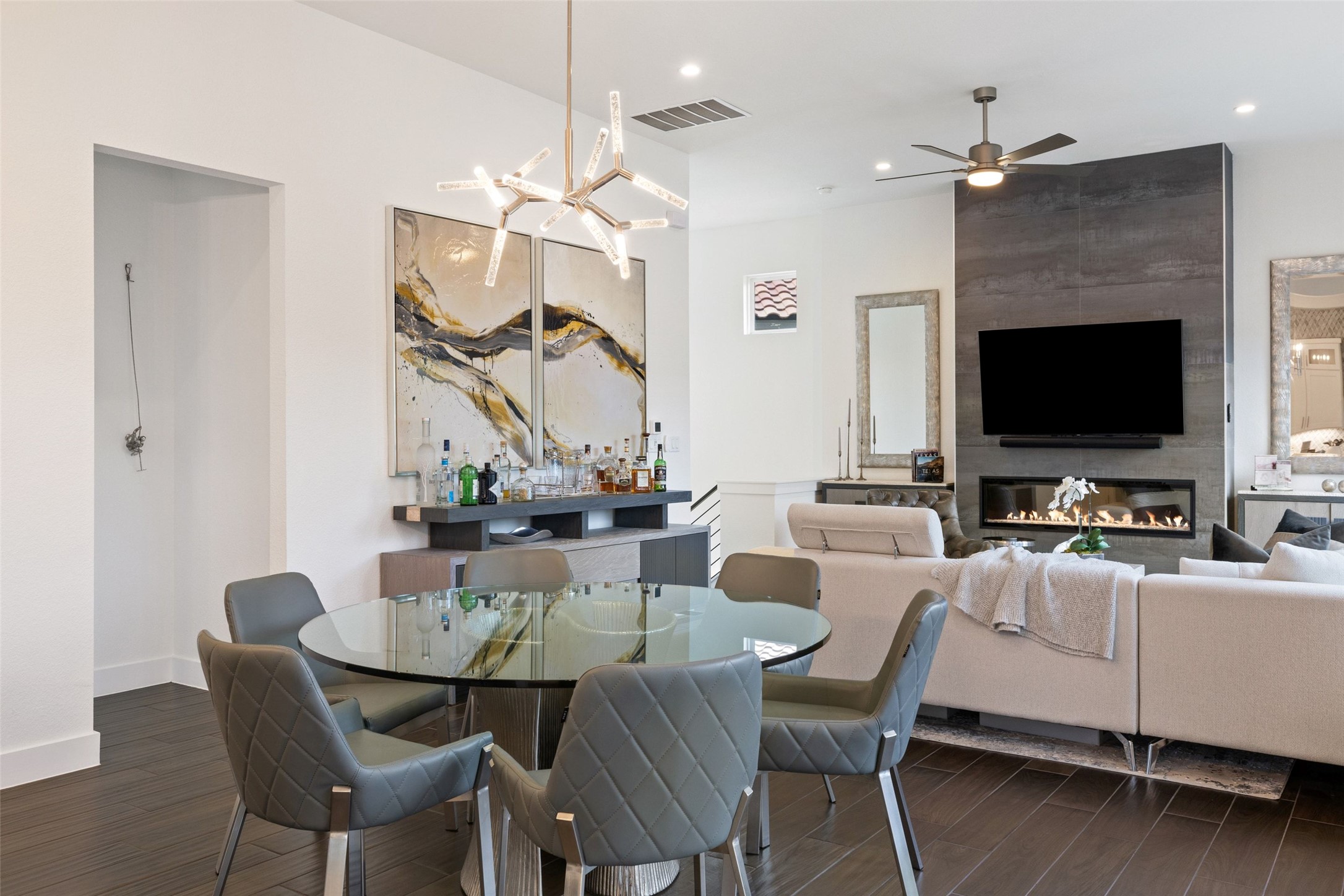 408 Rose Branch Way, Unit 24 Austin, TX 78738 - Photo 19 of 39 Dining space featuring a large fireplace, dark wood-style flooring, a chandelier, recessed lighting, and ceiling fan