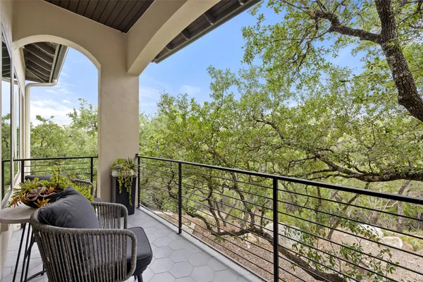 a view of balcony with furniture