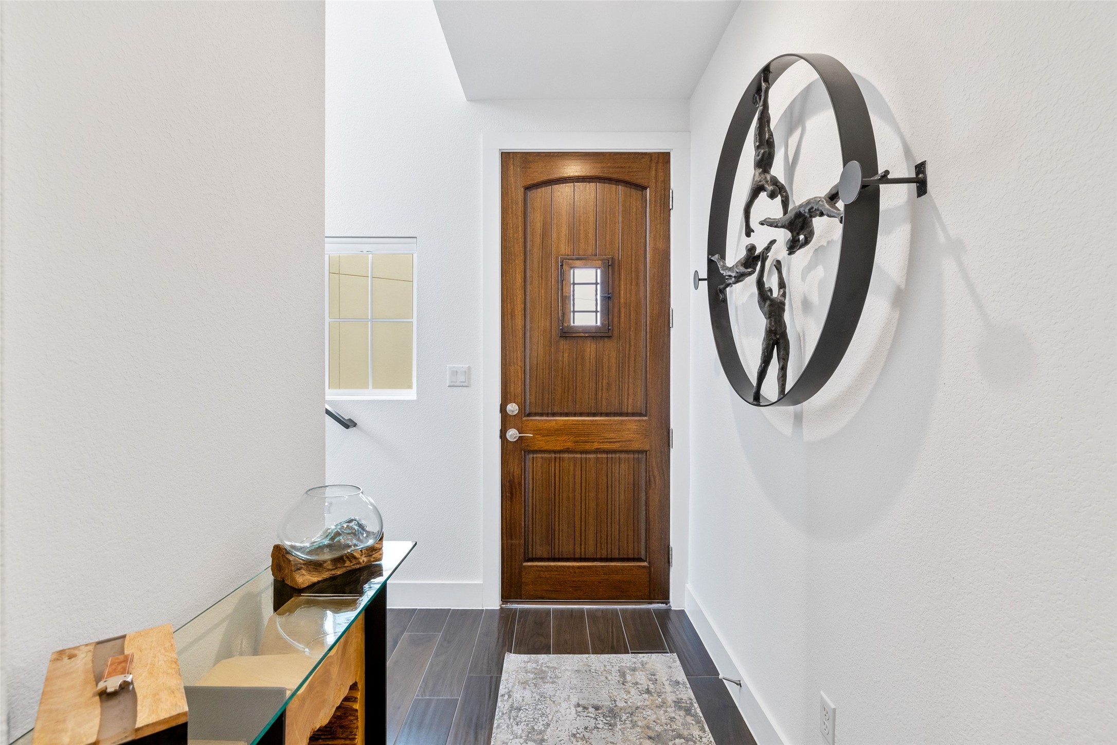 408 Rose Branch Way, Unit 24 Austin, TX 78738 - Photo 2 of 39 Doorway with wood tiled floors and baseboards