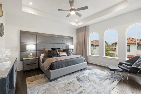 a bed room with a bed couch and a window