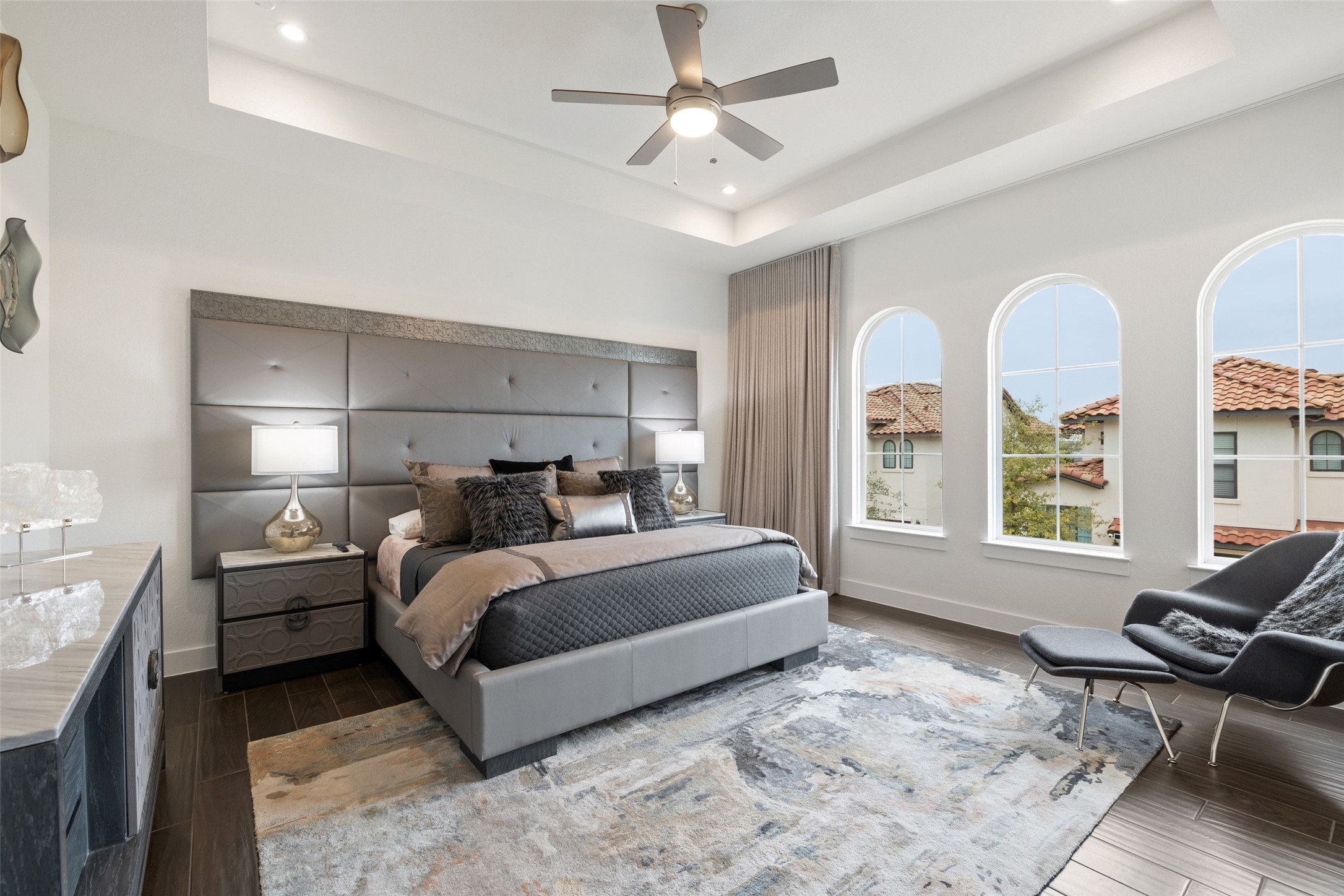 408 Rose Branch Way, Unit 24 Austin, TX 78738 - Photo 22 of 39 Bedroom with dark wood-style flooring, a ceiling fan, a tray ceiling, and recessed lighting