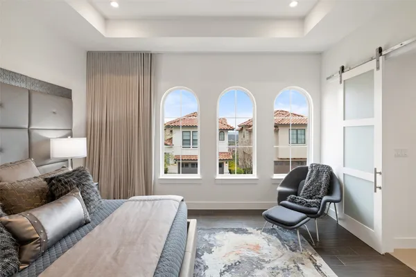 a bedroom with furniture and a window