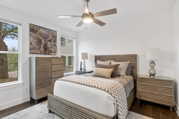 a bedroom with a large bed and a window