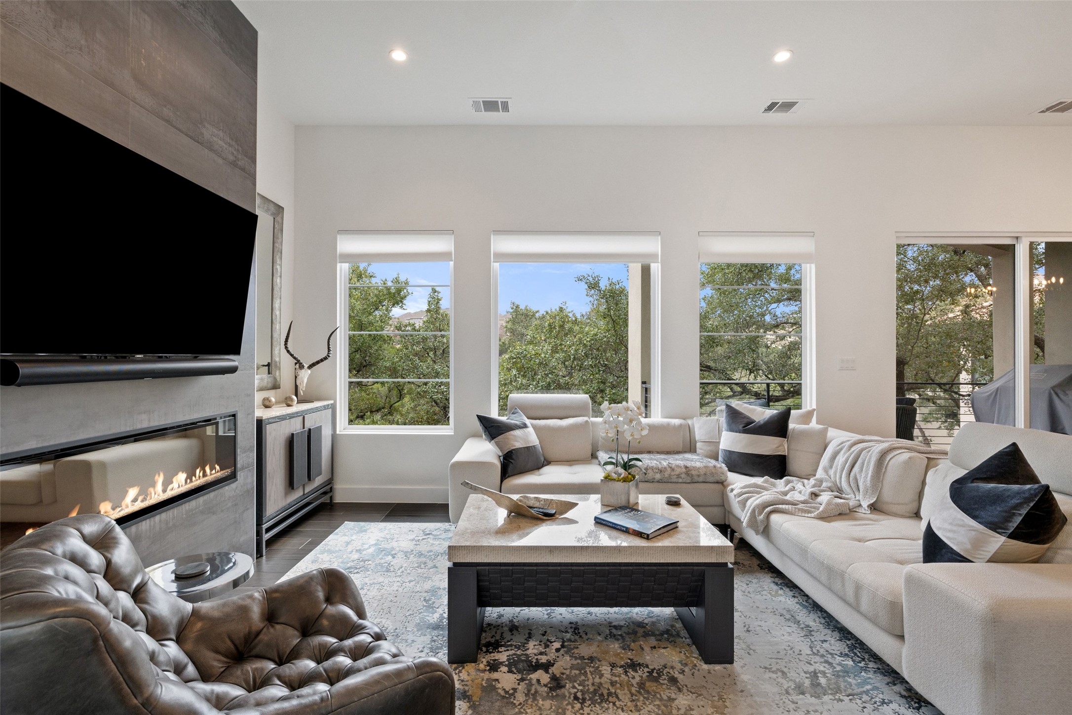 408 Rose Branch Way, Unit 24 Austin, TX 78738 - Photo 3 of 39 Living room featuring a fireplace and recessed lighting