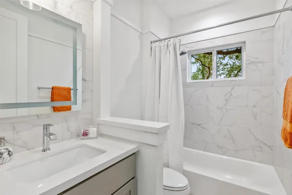a bathroom with a sink and a bathtub