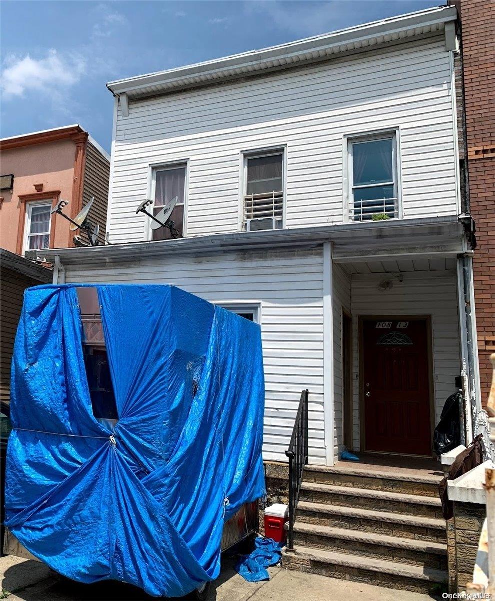 108-13 37th Avenue Queens, NY 11368 - Photo 11 of 23 a view of a house with a balcony and wooden floor
