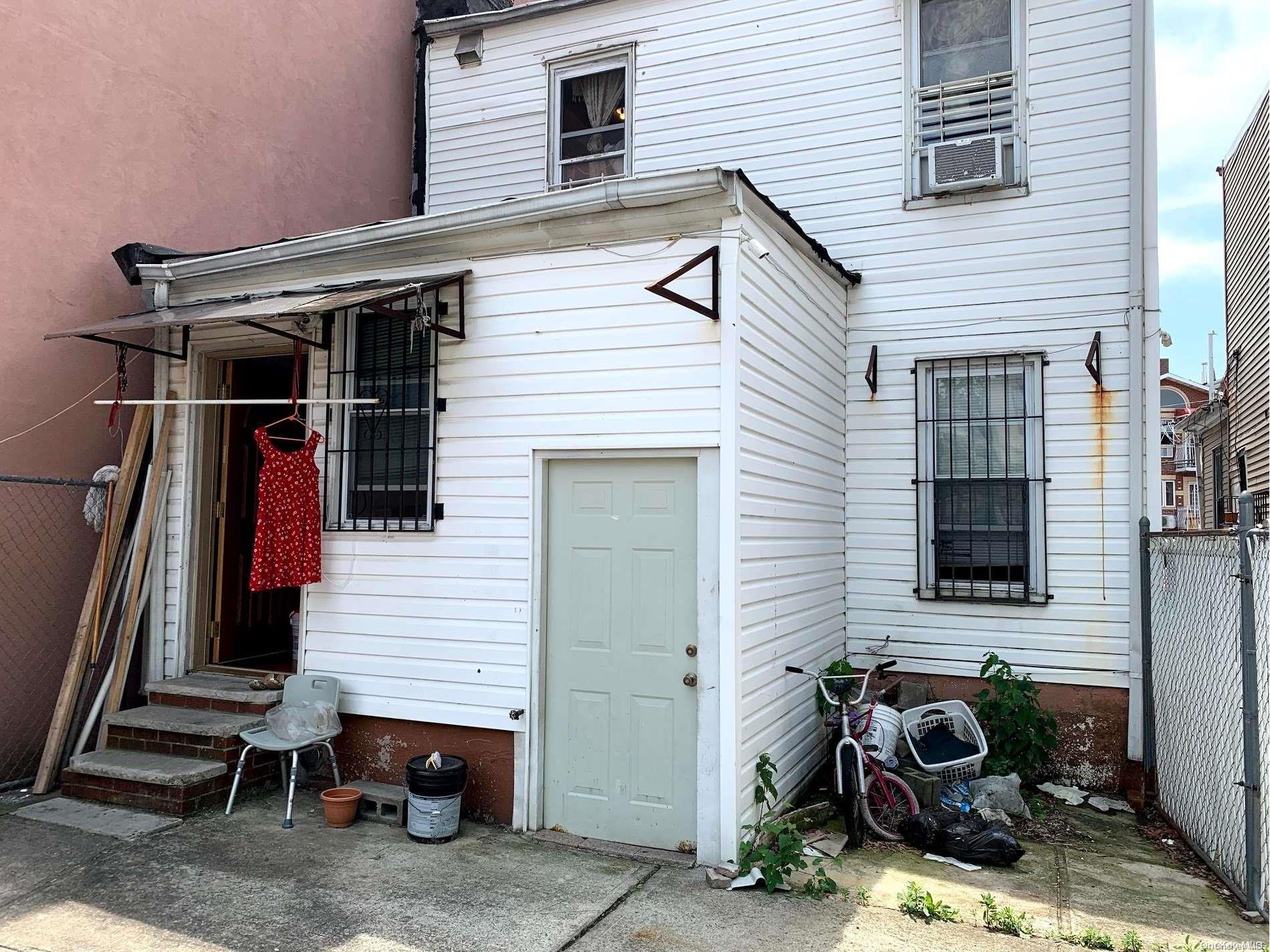 108-13 37th Avenue Queens, NY 11368 - Photo 23 of 23 a side view of a house with patio