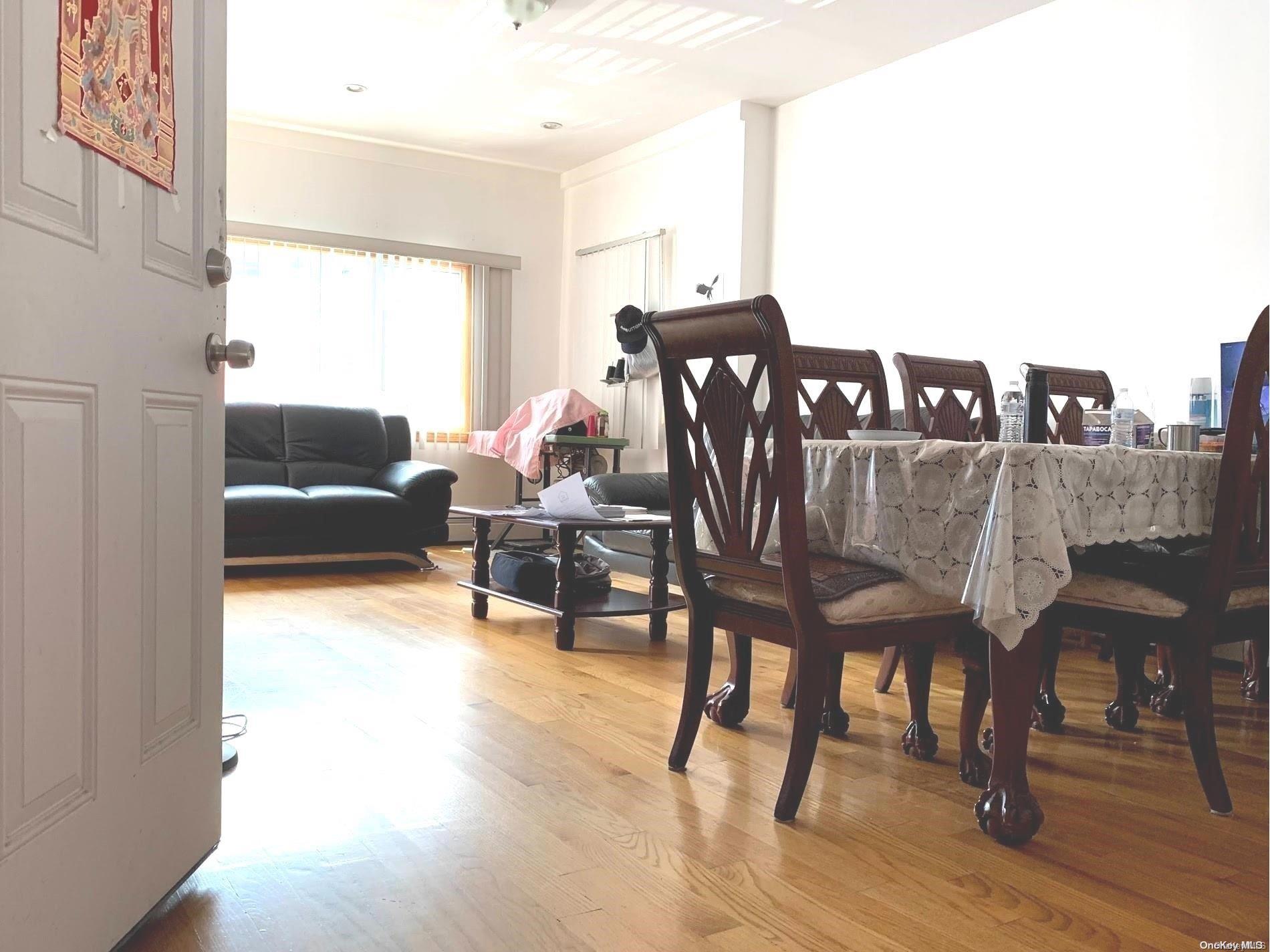 108-13 37th Avenue Queens, NY 11368 - Photo 6 of 23 a living room with furniture and wooden floor