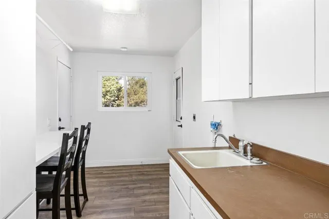 a view of an empty room with a fireplace and a fireplace