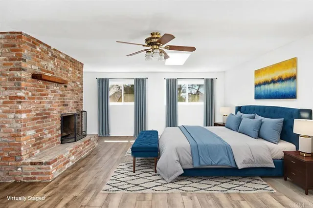 a bathroom with a granite countertop tub sink and mirror