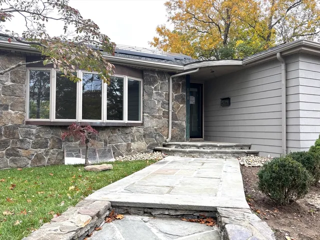 front view of a house with a yard