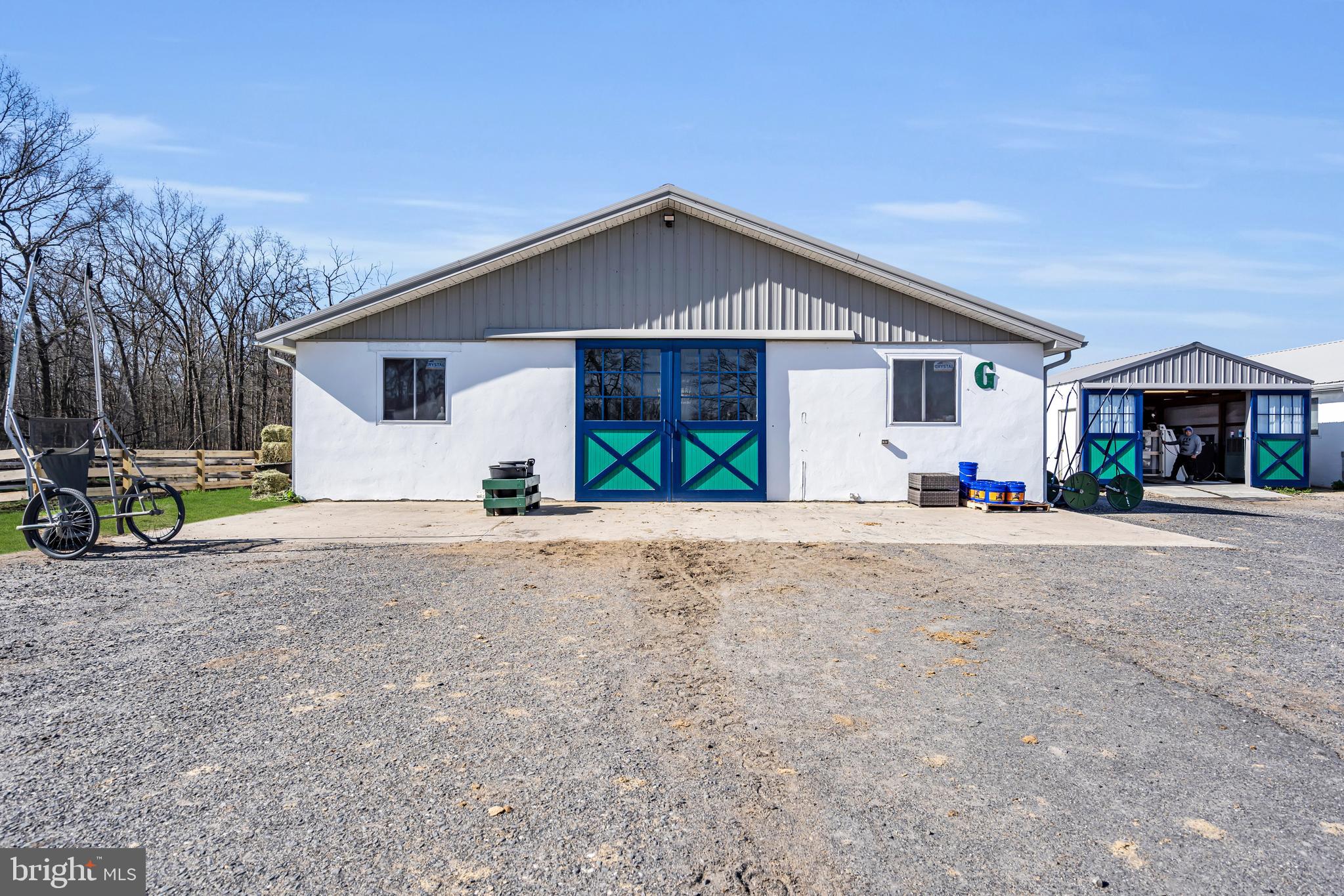 935 Lakewood Farmingdale Road Howell, NJ 07731 - Photo 12 of 28 a front view of a house with a yard and a garage