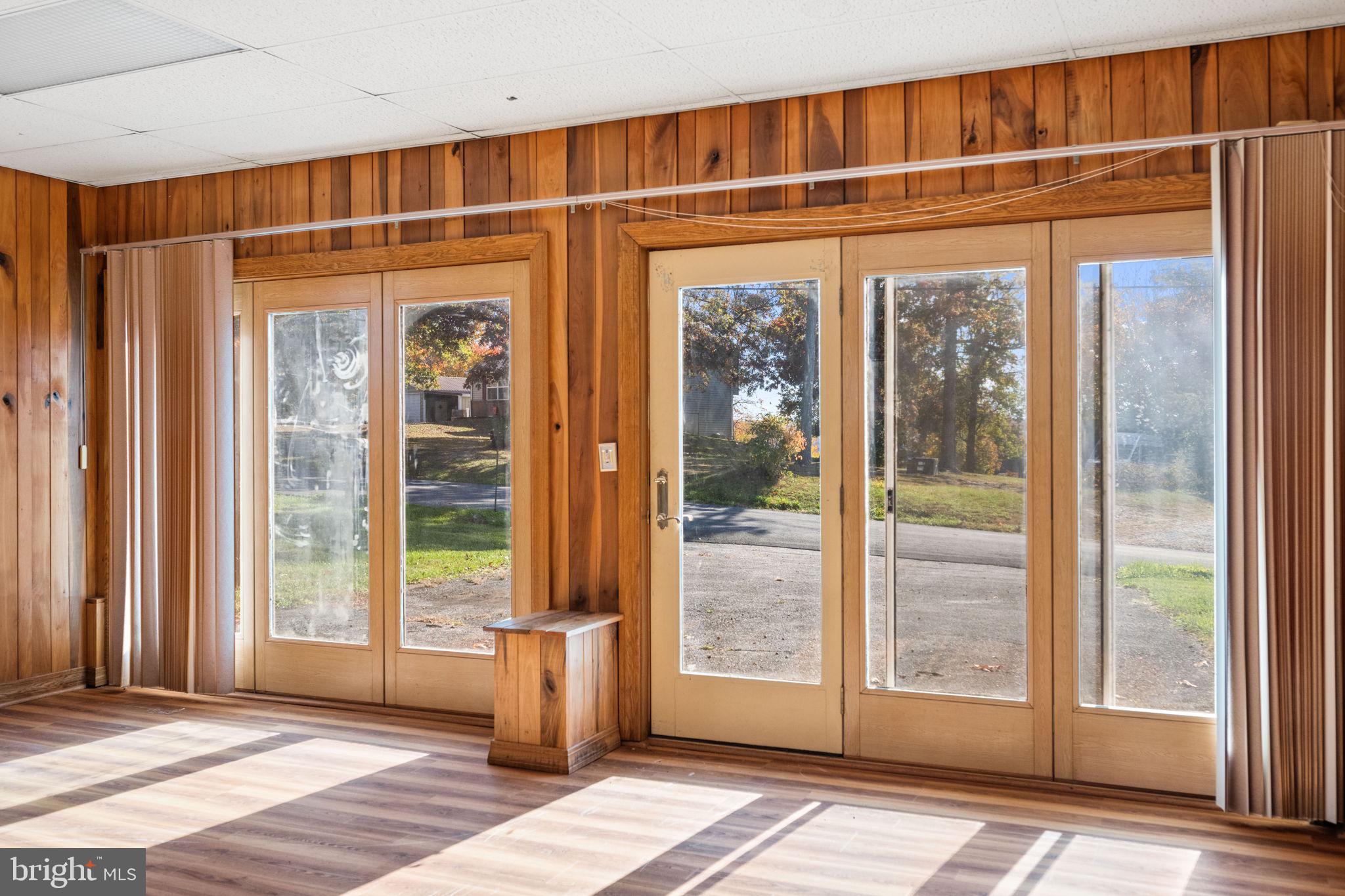 3744 Back Woods Road Westminster, MD 21158 - Photo 15 of 62 a view of an empty room with wooden floor and a window