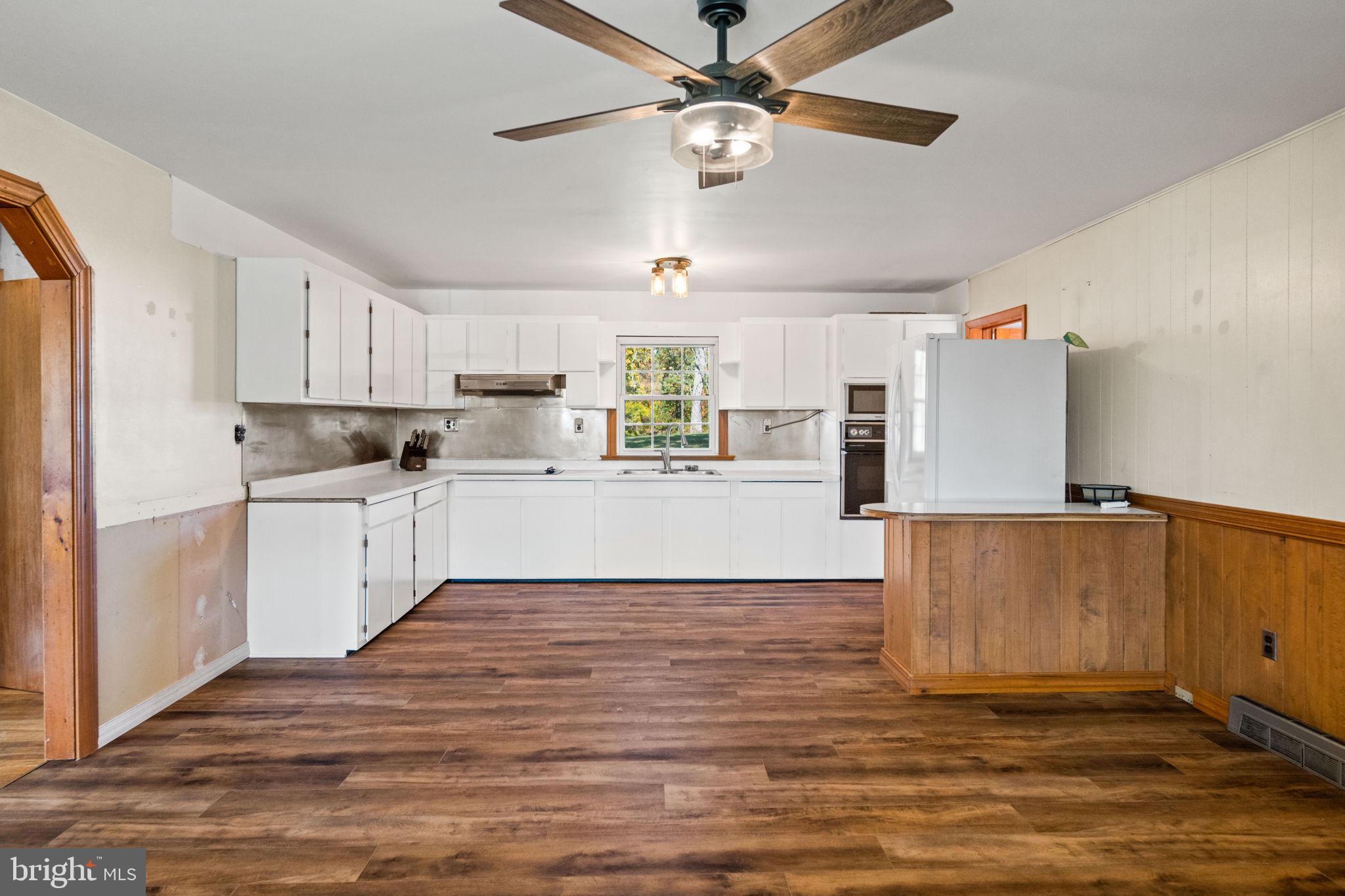 3744 Back Woods Road Westminster, MD 21158 - Photo 16 of 62 a kitchen with stainless steel appliances a refrigerator sink and microwave