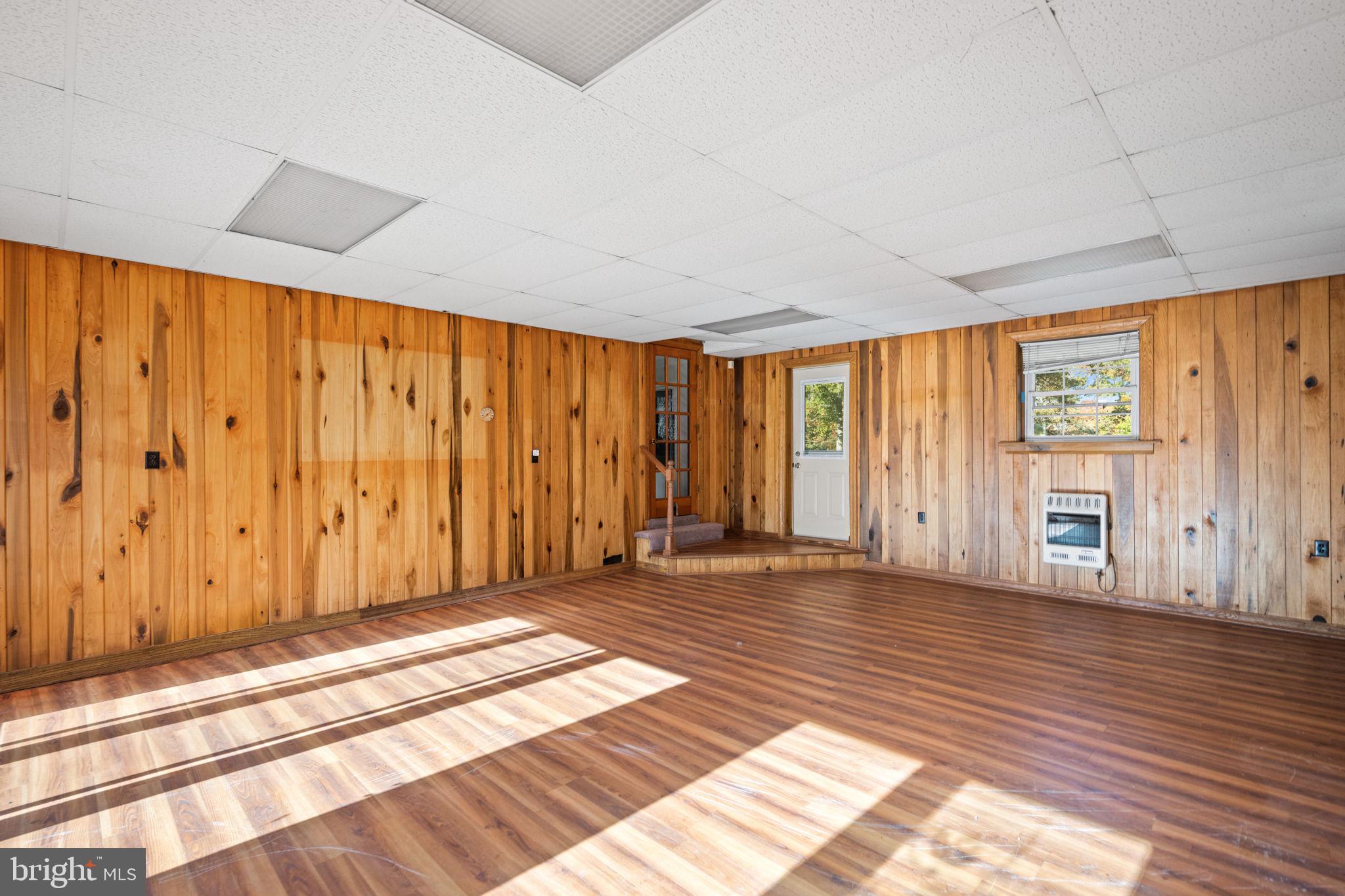 3744 Back Woods Road Westminster, MD 21158 - Photo 23 of 62 a view of an empty room with wooden floor and a window