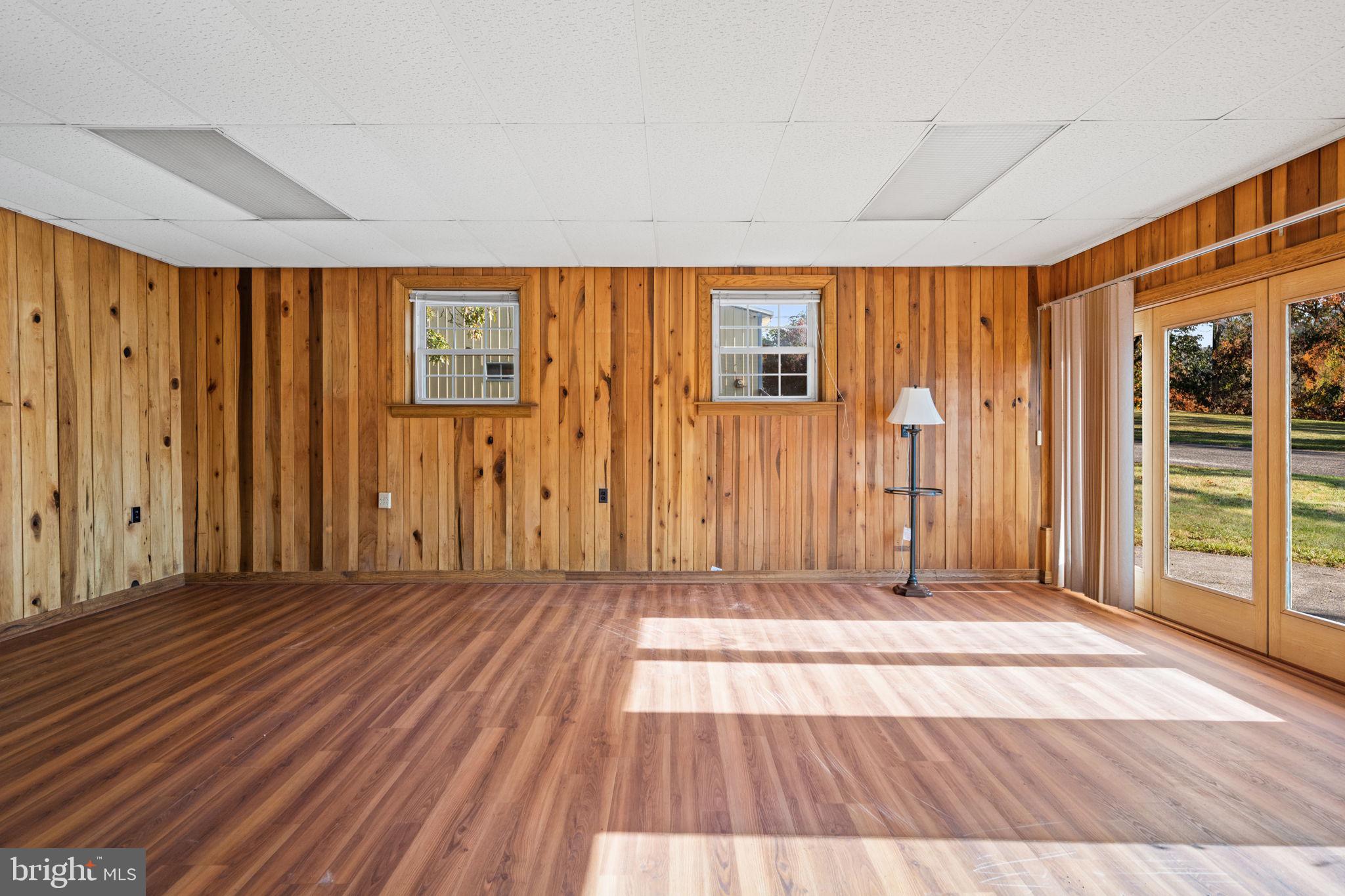 3744 Back Woods Road Westminster, MD 21158 - Photo 24 of 62 an empty room with wooden floor and windows