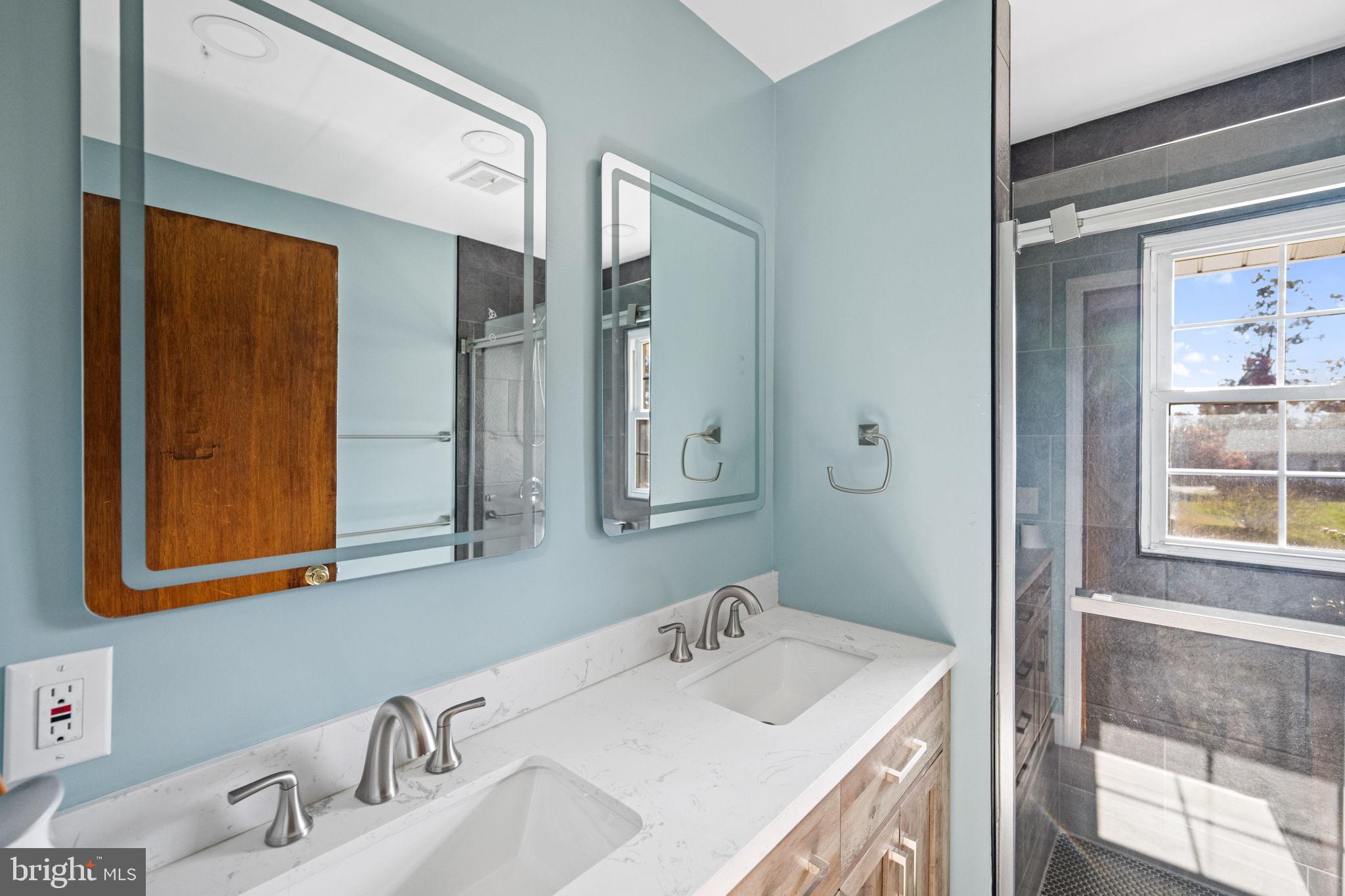 3744 Back Woods Road Westminster, MD 21158 - Photo 26 of 62 a bathroom with a sink and a mirror