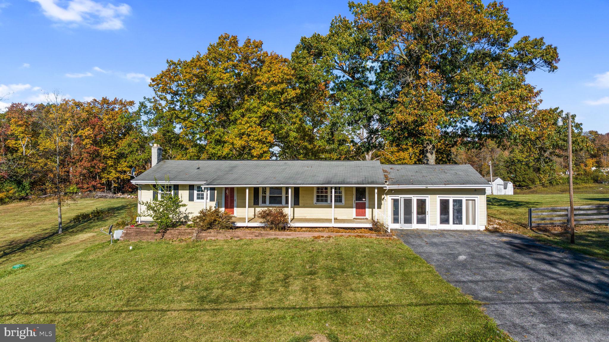 3744 Back Woods Road Westminster, MD 21158 - Photo 3 of 62 a front view of a house with a yard