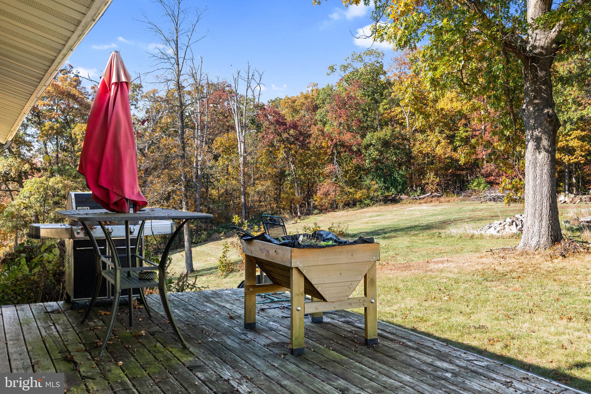 3744 Back Woods Road Westminster, MD 21158 - Photo 40 of 62 a view of a chairs on the deck