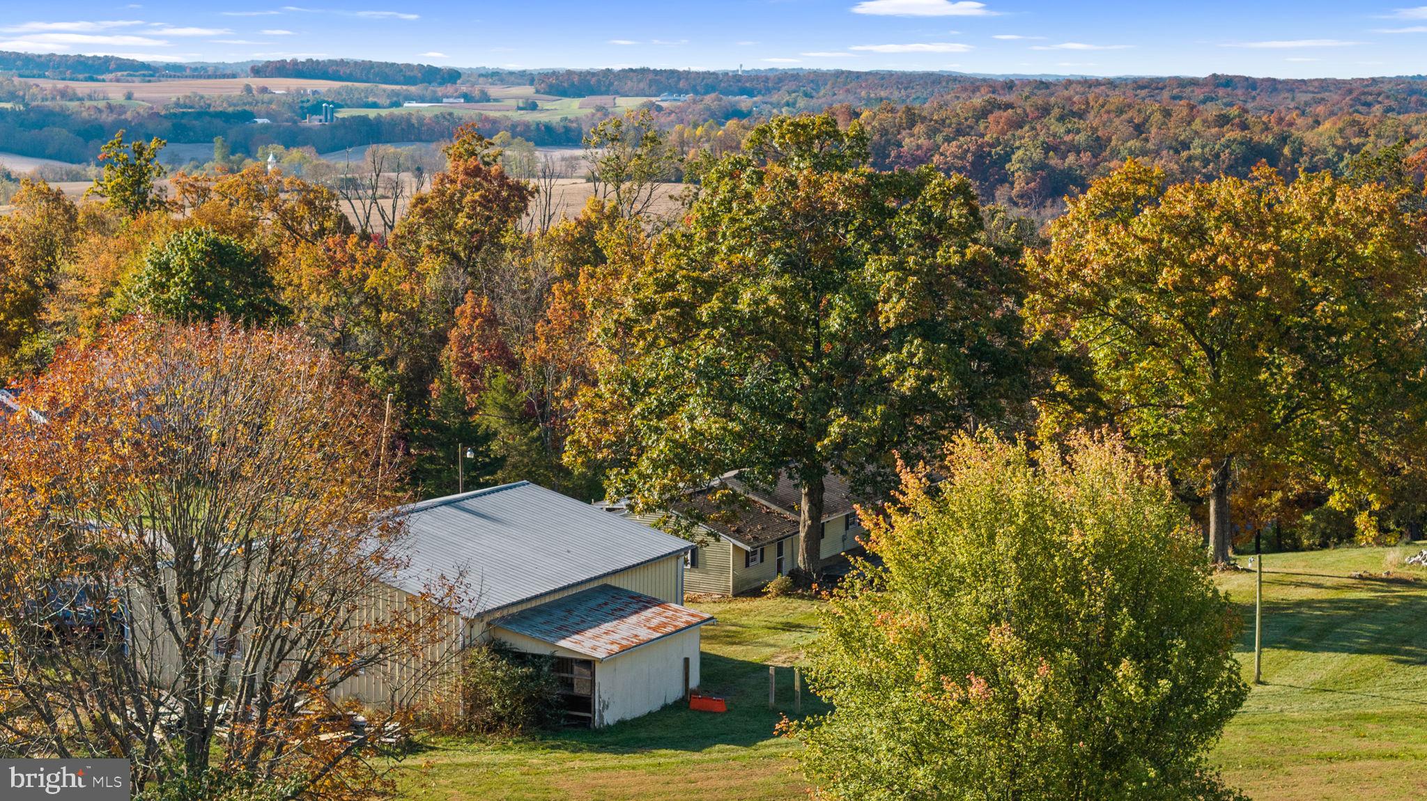 3744 Back Woods Road Westminster, MD 21158 - Photo 8 of 62 a view of a lake with a mountain in the background