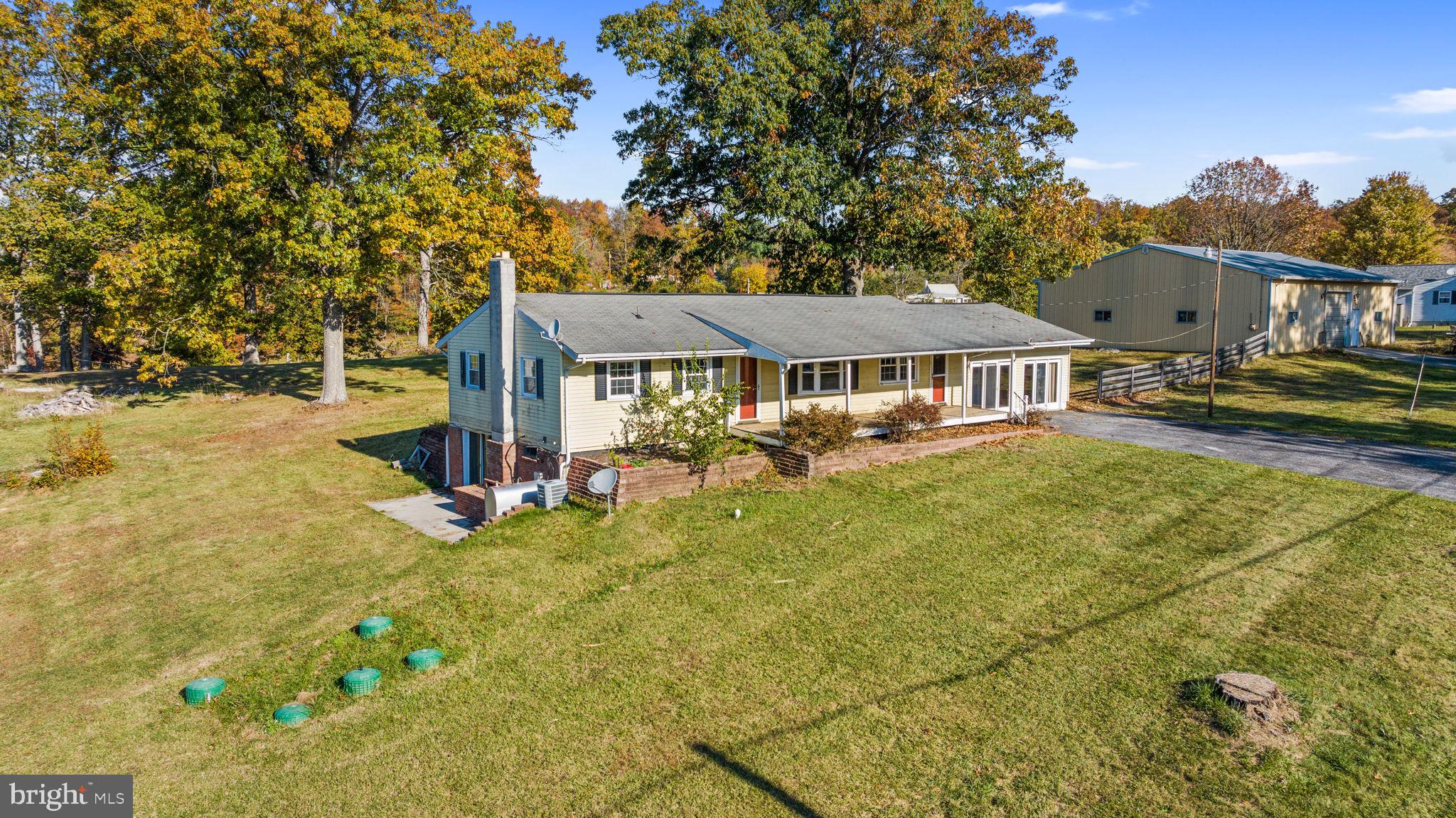 3744 Back Woods Road Westminster, MD 21158 - Photo 10 of 62 a view of a house with pool and chairs