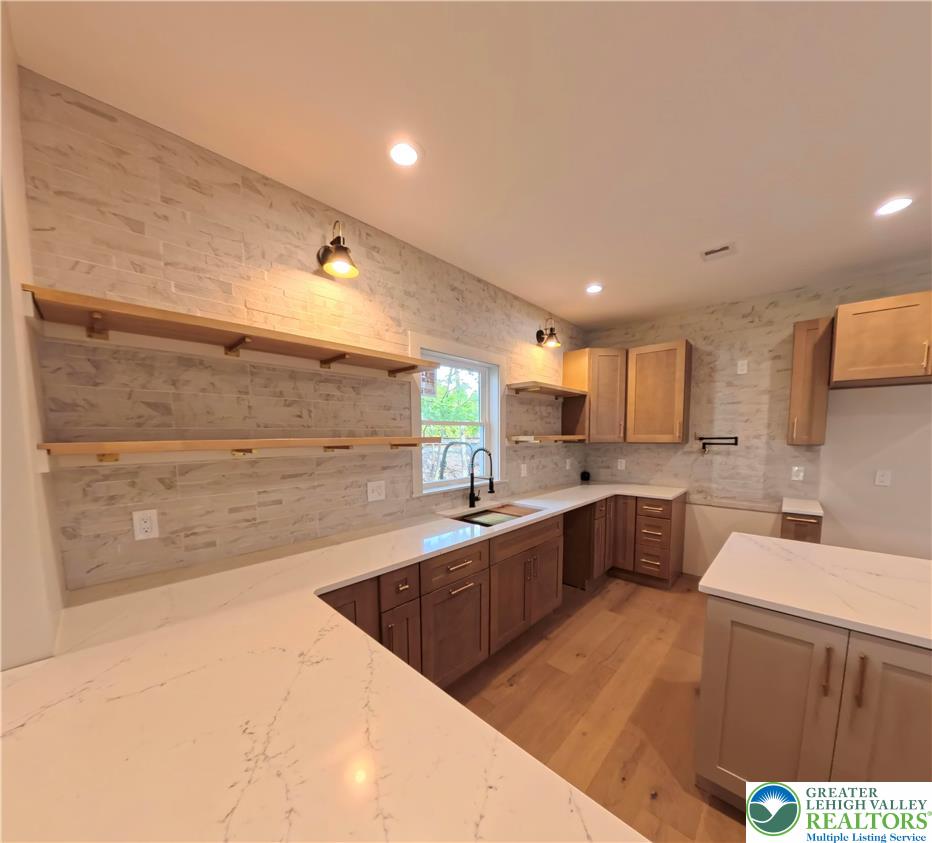 41 South 2nd Street Emmaus, PA 18049 - Photo 8 of 37 a kitchen with a sink and cabinets