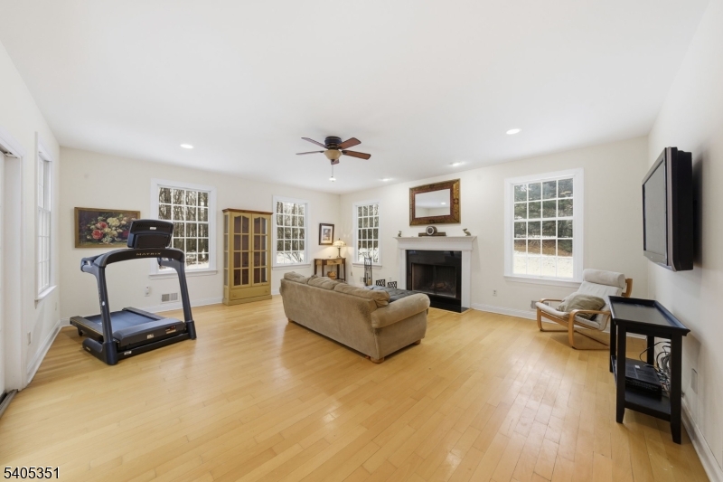 20 Sleepy Hollow Road Denville, NJ 07834 - Photo 11 of 49 a living room with furniture flat screen tv and a fireplace