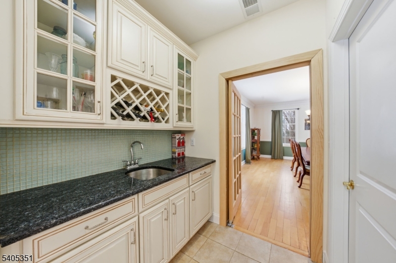 20 Sleepy Hollow Road Denville, NJ 07834 - Photo 21 of 49 a kitchen with a sink and cabinets