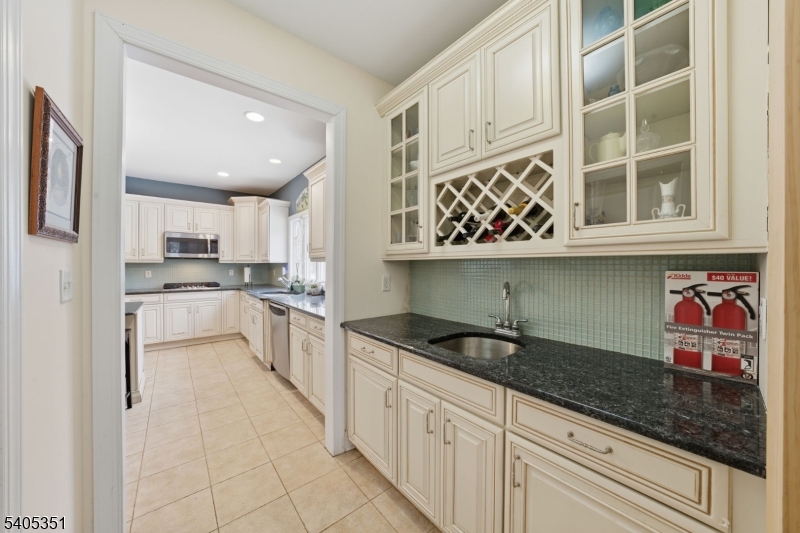 20 Sleepy Hollow Road Denville, NJ 07834 - Photo 22 of 49 a kitchen with stainless steel appliances granite countertop a sink and cabinets