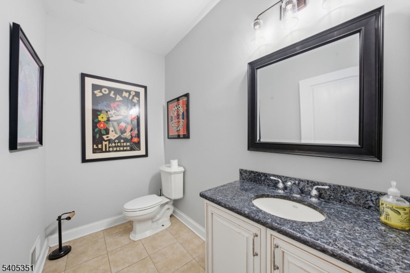 20 Sleepy Hollow Road Denville, NJ 07834 - Photo 26 of 49 a bathroom with a toilet a sink and mirror