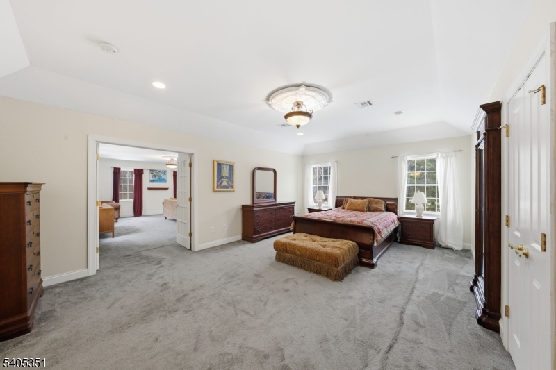 20 Sleepy Hollow Road Denville, NJ 07834 - Photo 28 of 49 a spacious bedroom with a bed couch and a window