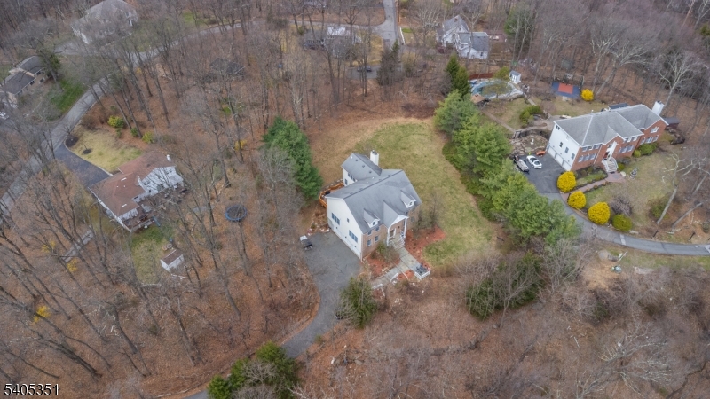 20 Sleepy Hollow Road Denville, NJ 07834 - Photo 38 of 49 a aerial view of a house with a yard and trees