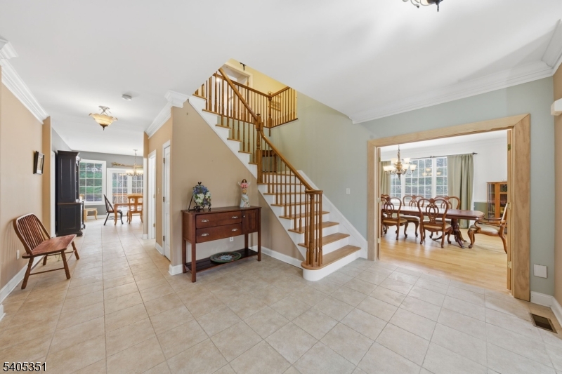 20 Sleepy Hollow Road Denville, NJ 07834 - Photo 4 of 49 a living room with furniture and a dining table with wooden floor